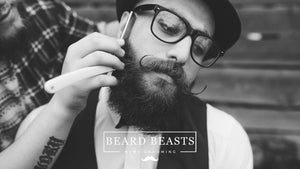 Man using grooming tools for styling, showcasing tips on how to grow a handlebar mustache with Beard Beasts Men's Grooming.