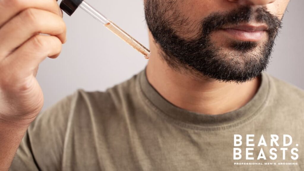A man with a well-groomed, full beard, standing in front of a dark, textured background. His beard is neatly shaped and has a healthy shine, reflecting proper beard care. The image highlights the importance of maintaining a clean, moisturized, and well-conditioned beard for a polished appearance.