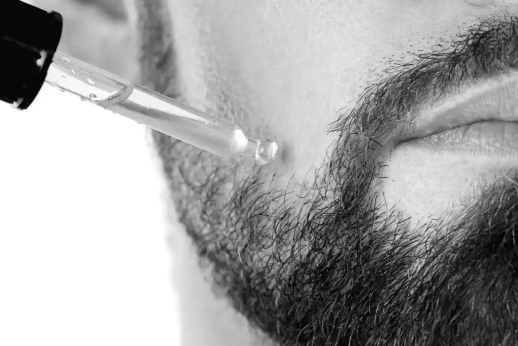 Beard oil applied to skin under the beard to prevent common beard grooming mistakes.