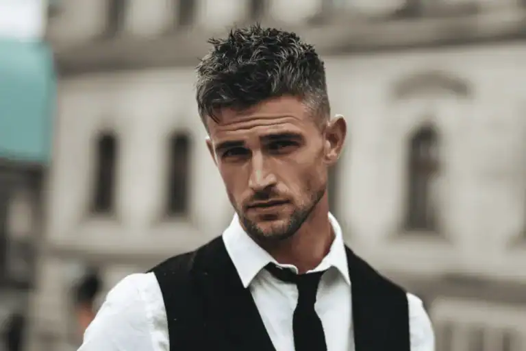 Man with a 5mm beard and heavy stubble, showing a sharp, controlled short beard style suitable for professional wear