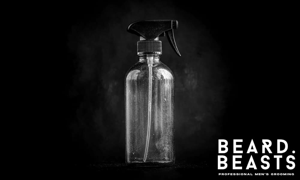 Blue sea salt spray bottle for men’s hair, used to enhance texture, volume, and natural wave definition.