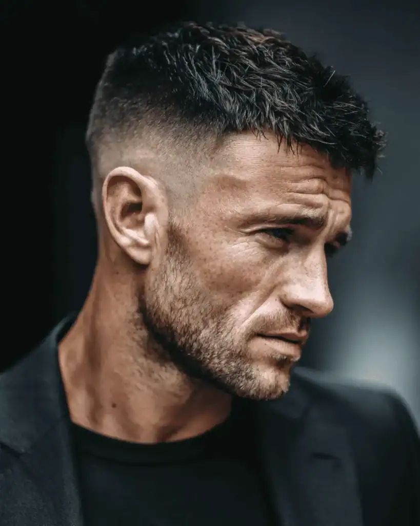 Man with a 6mm beard and short fade haircut showing a clean, intentional short beard style