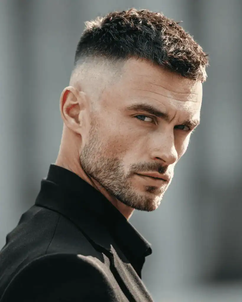 Man with a 6mm beard and short fade haircut showing a sharp, intentional short beard look