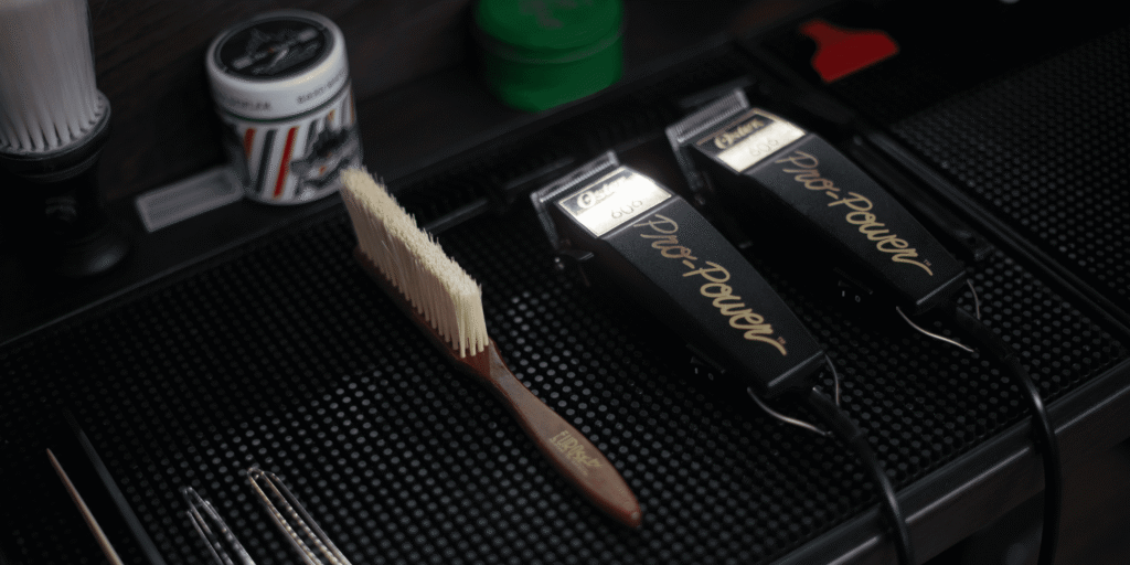 a photo of a pair of hair clippers on a barbershop table