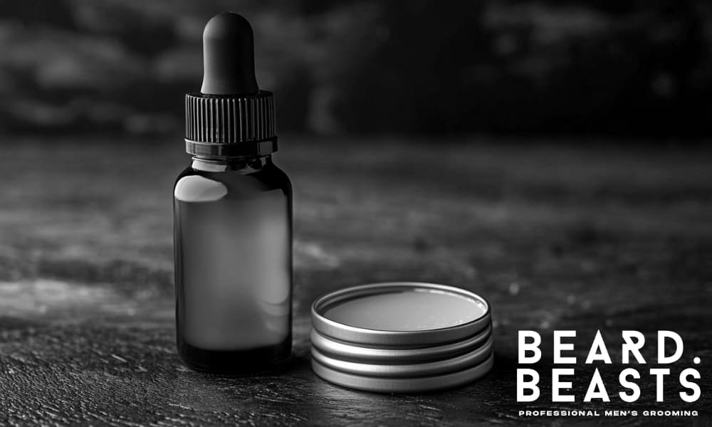Beard oil bottle with dropper and open tin of balm on dark surface—used to nourish and support beard growth
