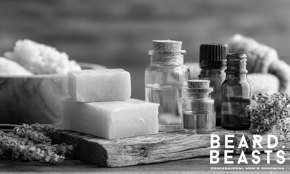 Natural beard butter ingredients on a rustic table, including shea butter, essential oils, beeswax, and dried lavender.