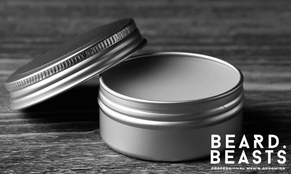 Open tin of beard balm on a wooden surface showing product texture and consistency