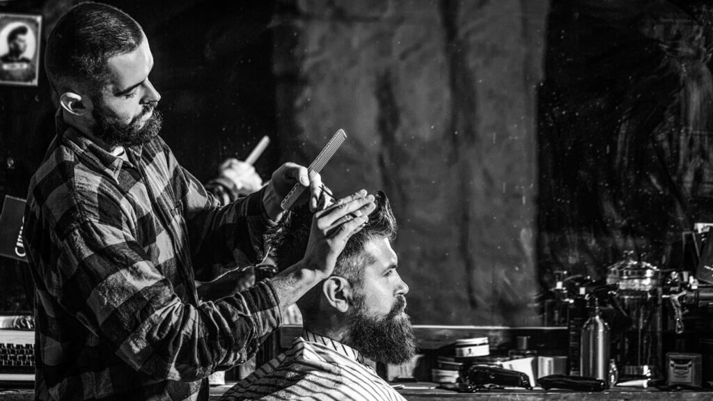 Barber meticulously crafting a crew cut for a client who wondered how to ask for a crew cut