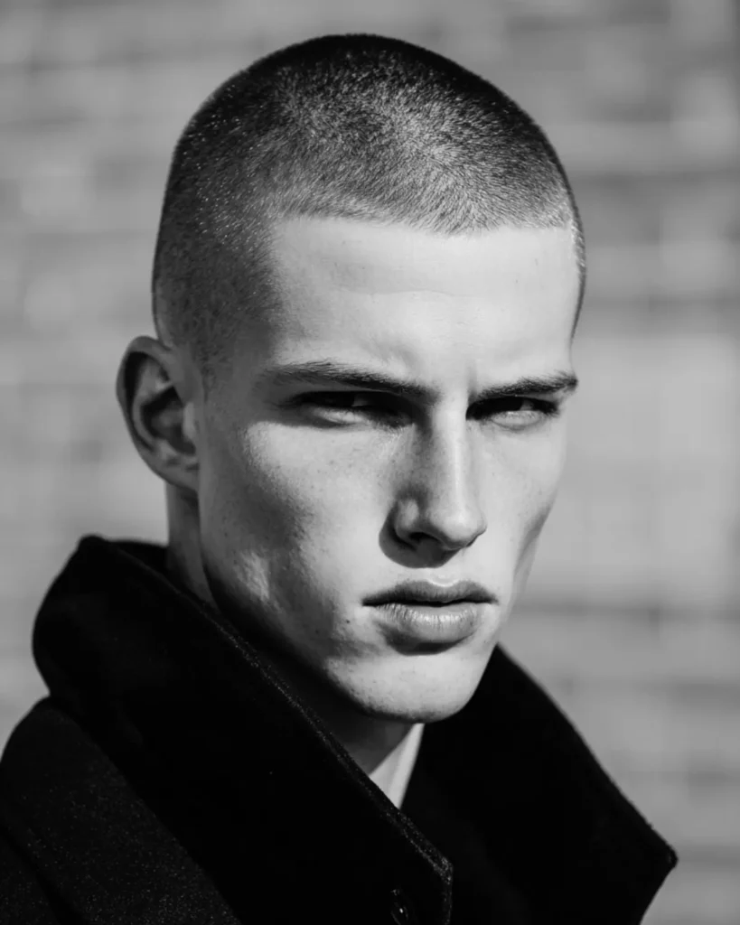 Men’s buzz cut hairstyle with short even length and sharp outline