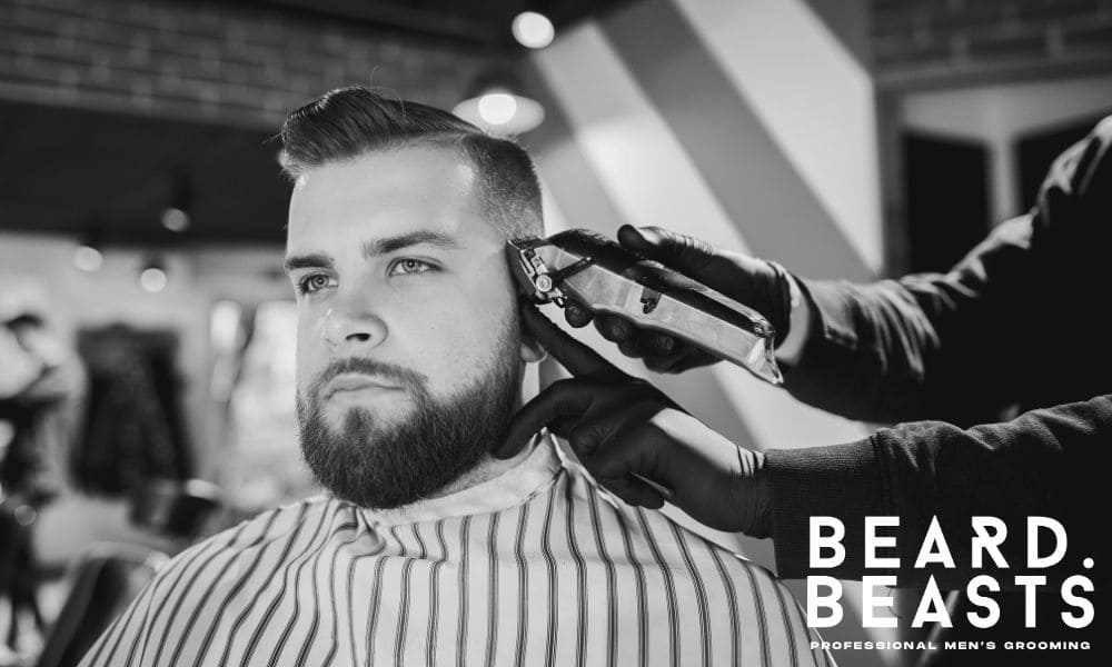 Man getting a precise haircut at a barbershop—knowing what you want before sitting in the chair is key to a great result.