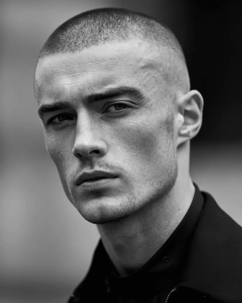 professional buzz cut with high fade, close-up three-quarter view