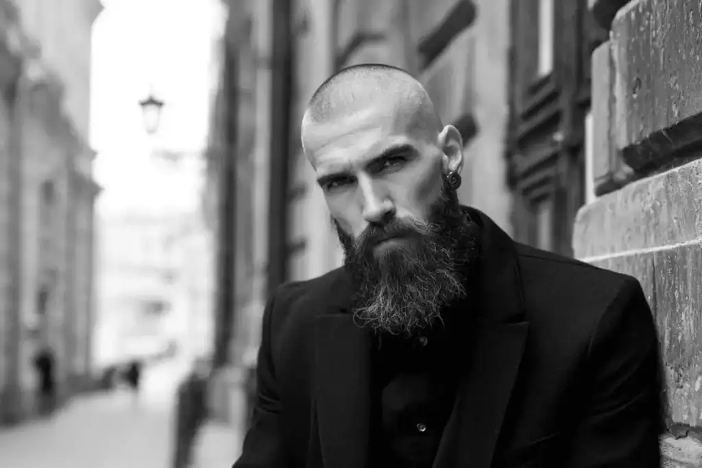 Model wearing a sharp 3mm haircut (Grade 1 buzz cut) showing the uniform short length and visible scalp texture