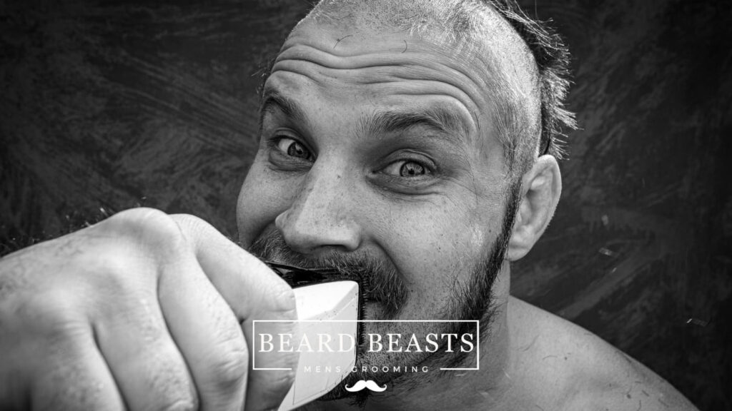 Man giving himself a 1mm haircut with professional clippers.