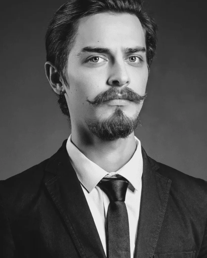 medium anchor beard style with pointed chin and connected mustache