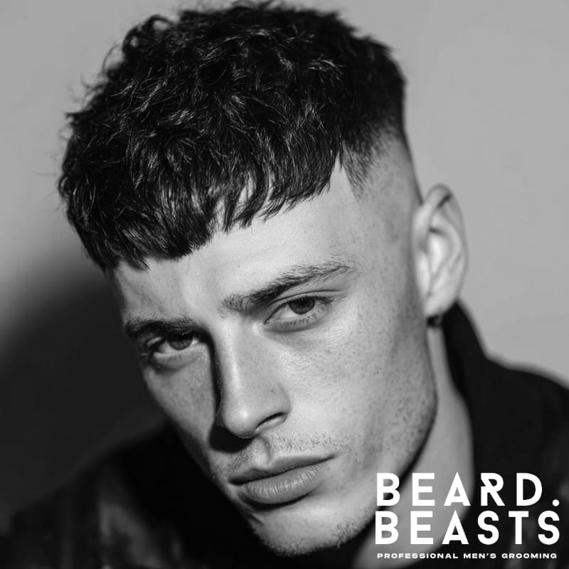 Men's French crop fade with textured, short hair on top and a clean fade on the sides. Ideal for men looking for a modern, sharp look with minimal maintenance.