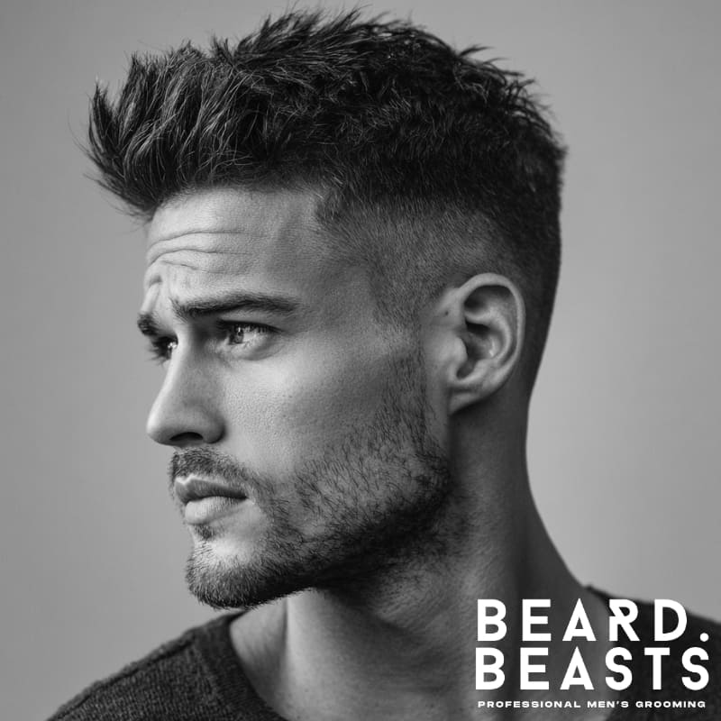 Men's quiff with fade, featuring voluminous hair on top and a clean fade on the sides. Ideal for a stylish, modern look with a bold contrast.