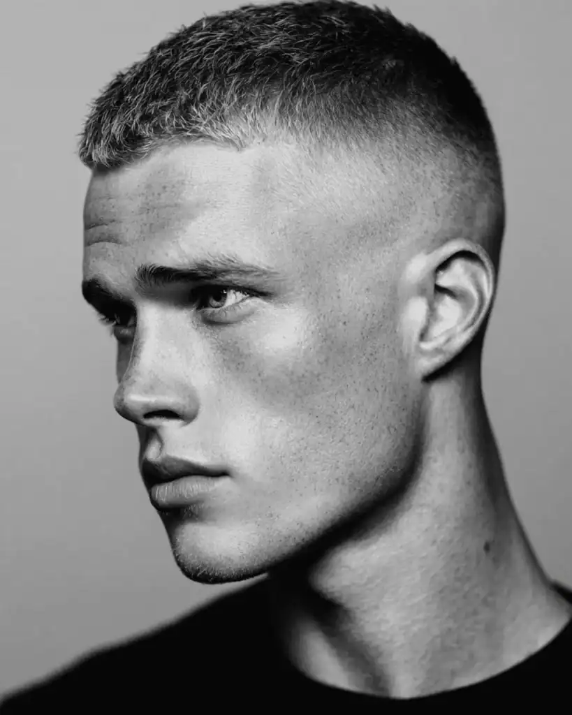 High fade crew cut with very short textured top and tight skin fade on the sides