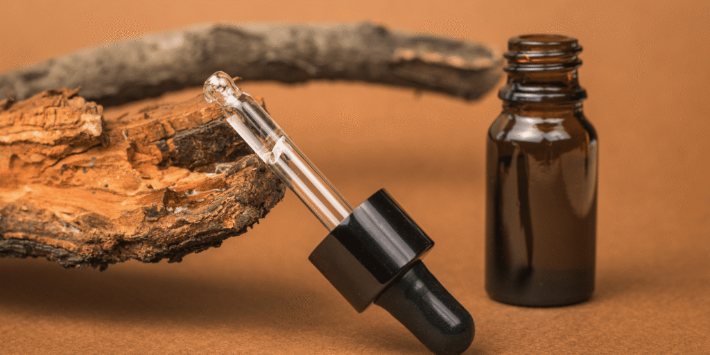 Close-up of a bottle and dropper of beard oil, debunking the common myth that beard oils and supplements can quickly grow your beard. Highlighting the benefits of beard oils for hydration and appearance, while emphasizing that they do not accelerate beard growth. Debunking myths about beard growth and effective beard care.