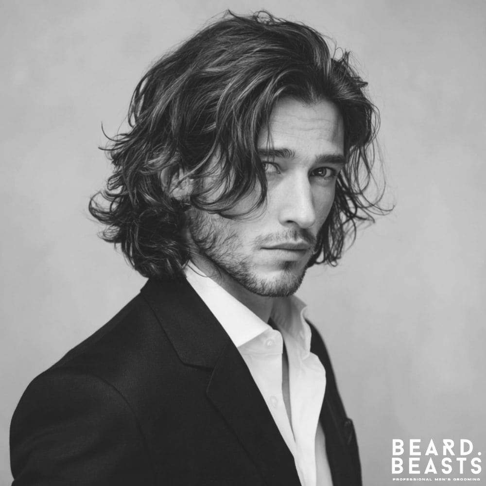 Shoulder-Length Waves - A natural and flowing Long Professional Men’s Hairstyle featuring relaxed waves at shoulder length, perfect for a stylish yet polished look in creative or relaxed corporate environments.