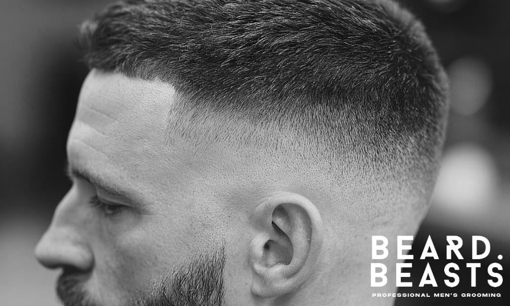 Close-up shot of a clean and defined blend with short hair on top, transitioning smoothly into the skin, giving a sharp and polished look.