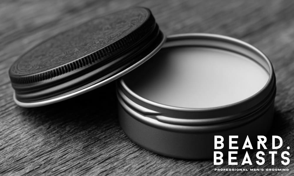 A close-up of an open tin of matte clay, ideal for styling hair and achieving a textured finish.
