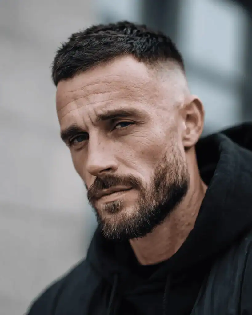 man with a short boxed beard faded in the sides