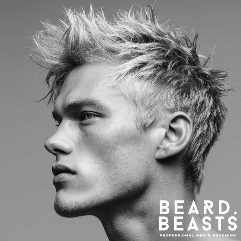 Classic messy spiky hairs on a model with textured, voluminous spikes, showcasing a bold yet effortless look for men. Ideal for adding volume and texture to short haircuts.