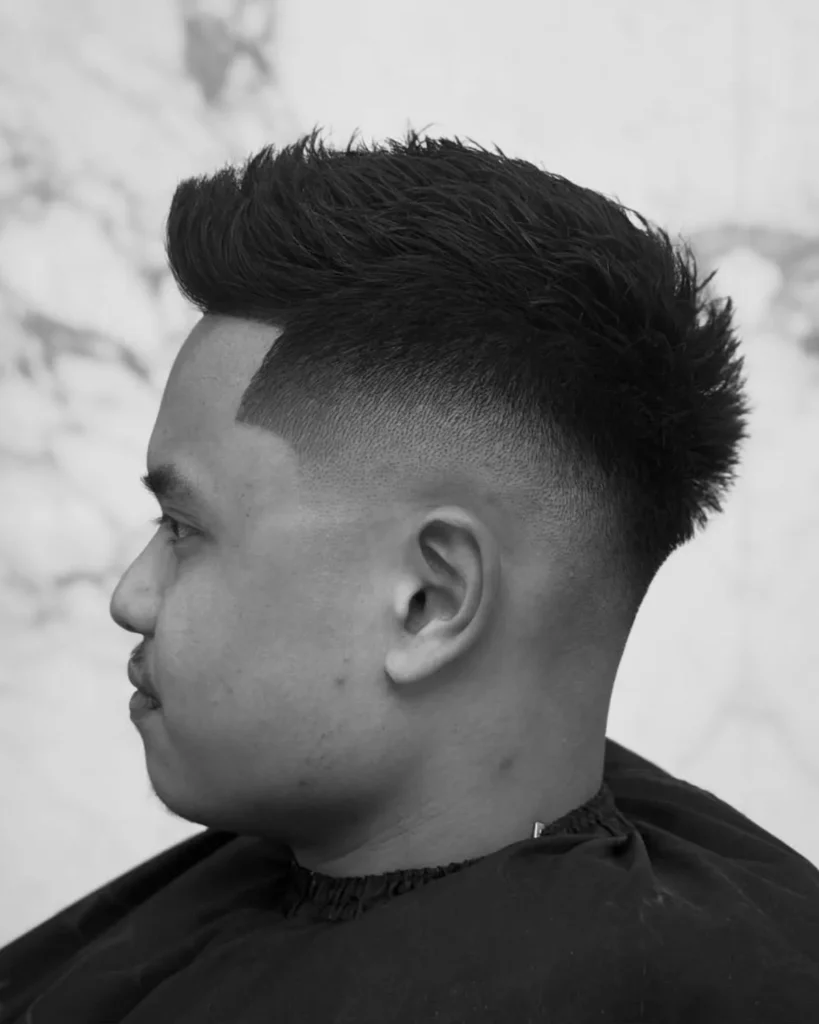 drop fade short textured quiff haircut with curved fade line and textured front, black and white
