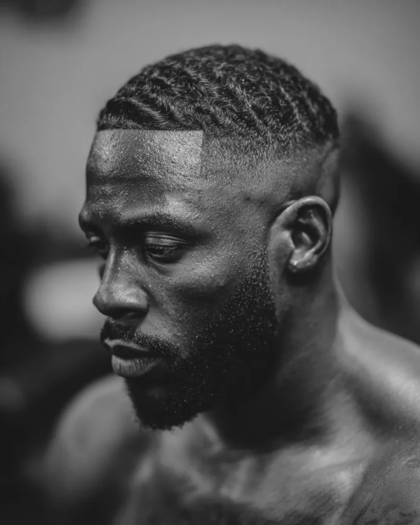 men's 360 waves with skin fade athletic hairstyle on Black man after training, side profile view