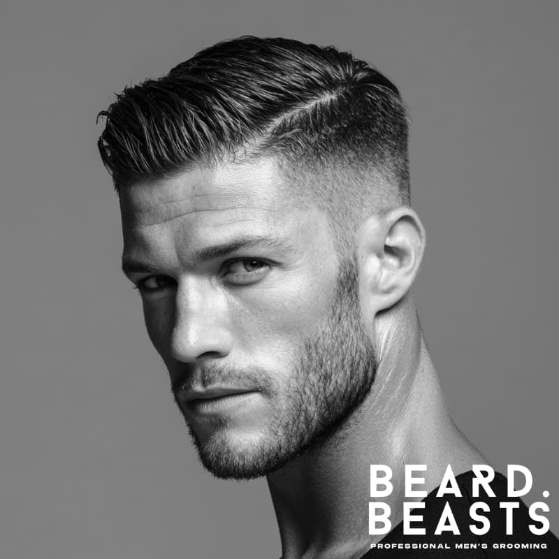 Young male model with a textured side part fade haircut for men, combining a sharp fade with natural texture for a modern, clean look.