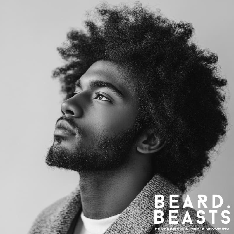 ide profile of a Black man with a natural afro hairstyle, showcasing full texture and volume in a modern outfit.