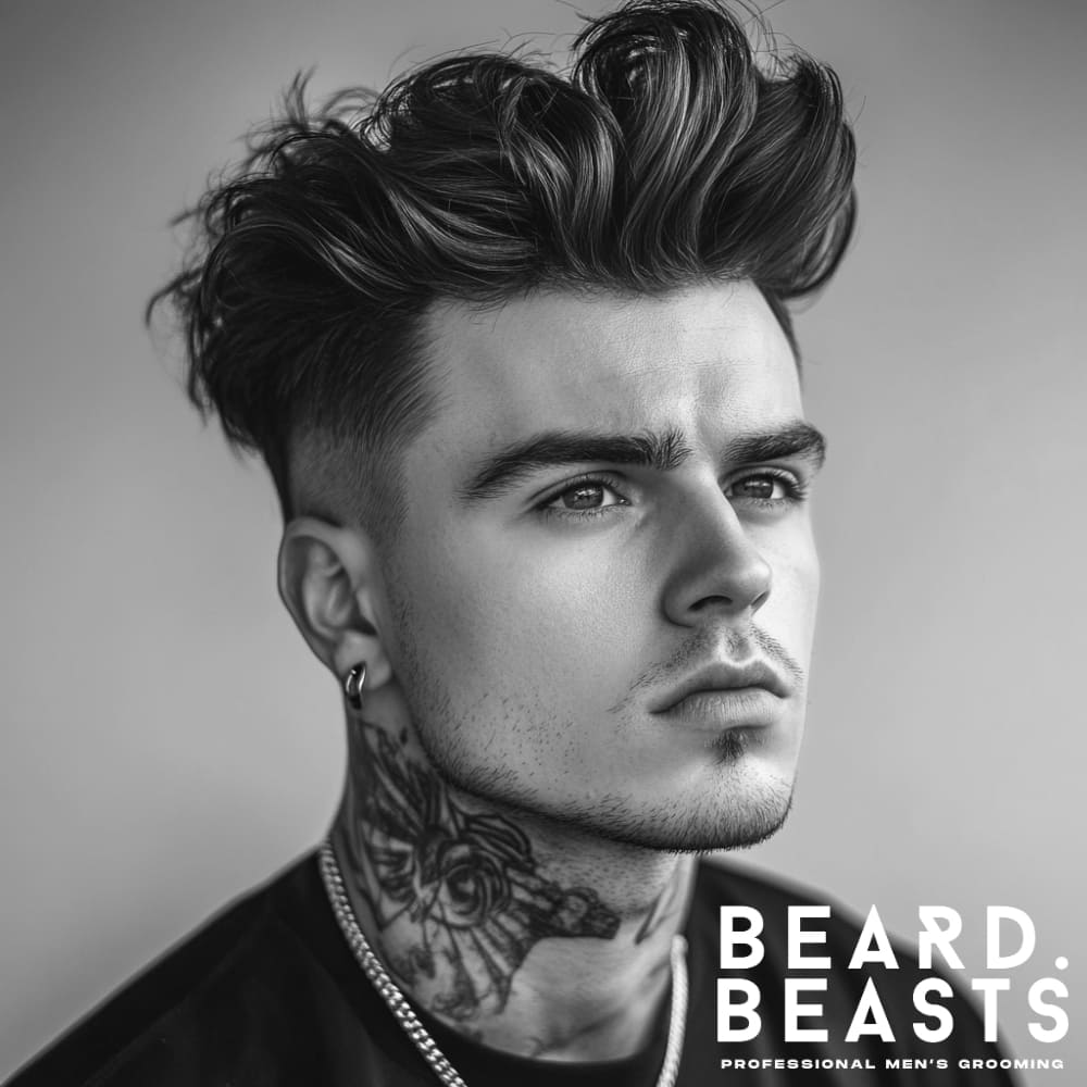 Handsome man with a messy pompadour hairstyle, showcasing voluminous, textured hair with a natural, tousled look. The hairstyle features a clean fade on the sides, highlighting the bold and modern pompadour shape. The model has visible neck tattoos, wears a black t-shirt, and exudes a confident and stylish vibe.