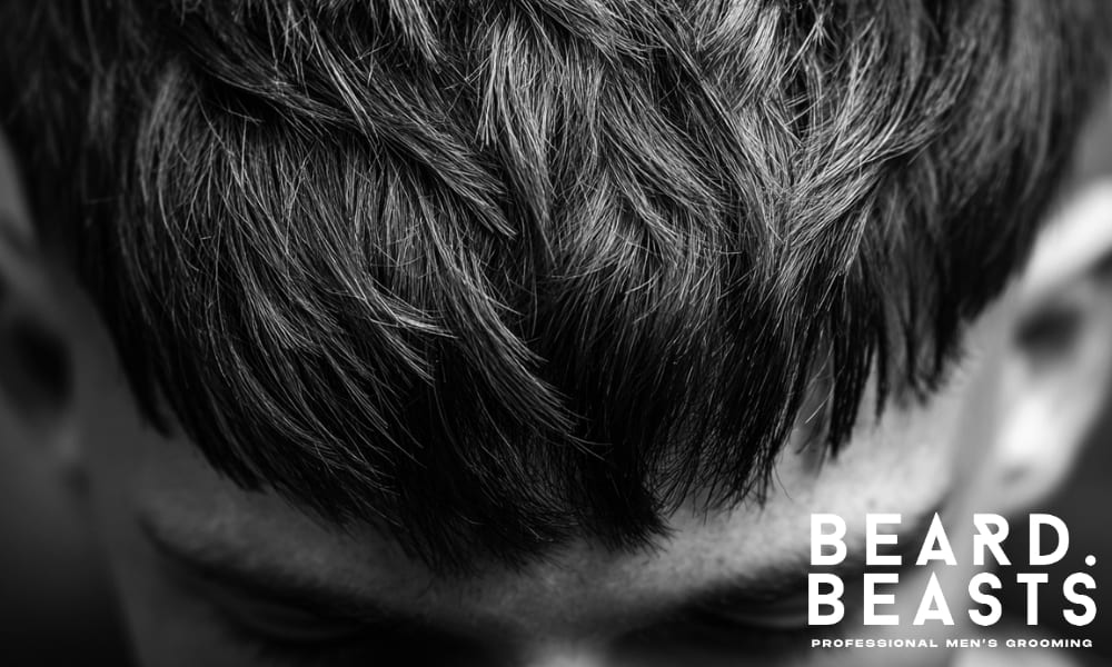 Close-up of a fringe haircut showcasing short, layered texture and natural movement. The hairstyle offers a clean, structured look with soft, tousled layers