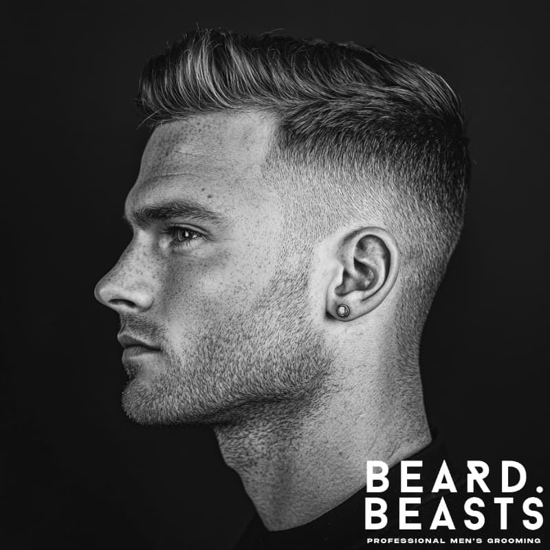 Man with short straight hair and a mini quiff—clean fade and side-swept volume, ideal for modern men’s short straight hairstyles.