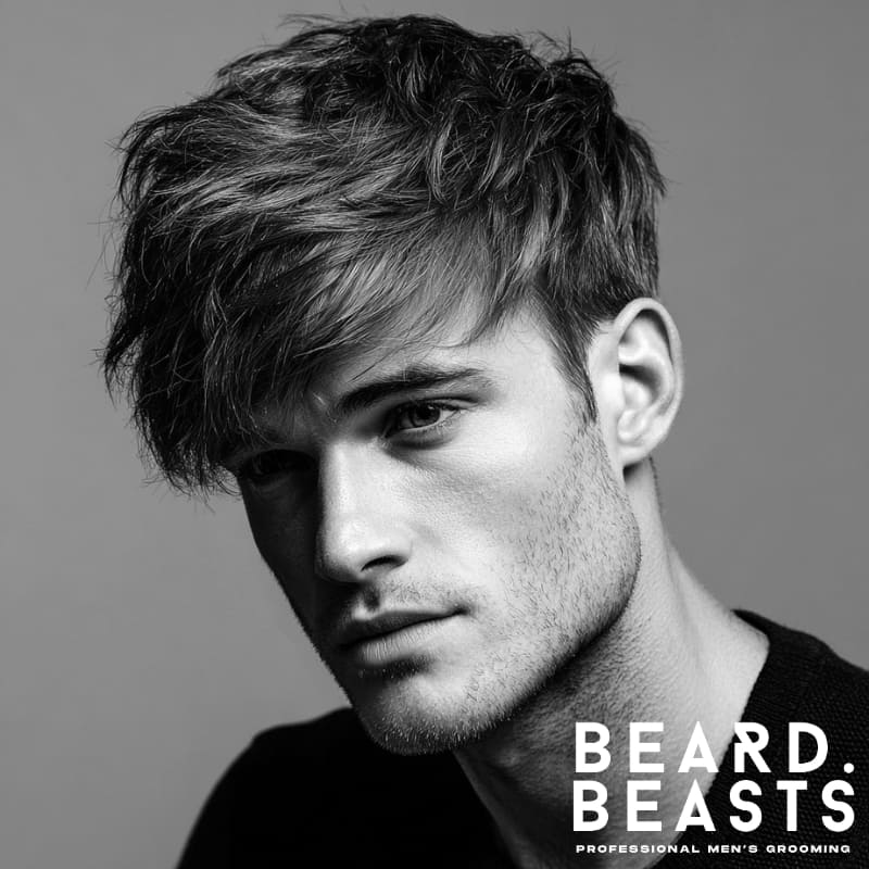 Side-swept textured fringe haircut with layered, voluminous texture and a natural finish. A relaxed yet refined style that enhances movement and adds effortless volume.