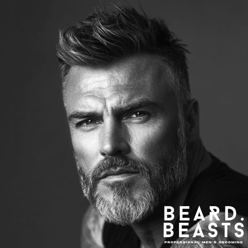 Older man with a short boxed beard and styled hair, showcasing a sharp and defined grooming look ideal for modern mature men.