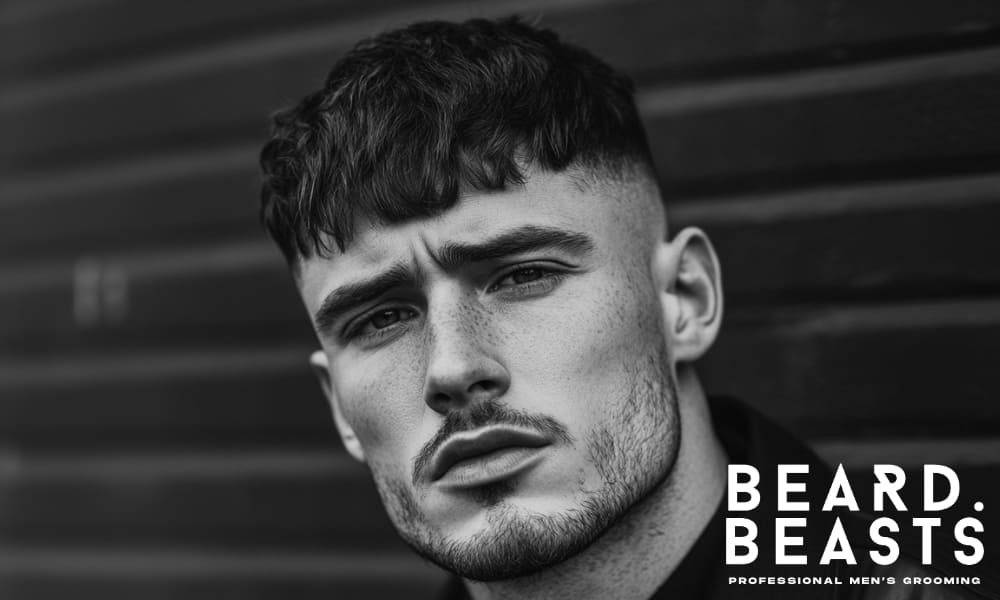 Textured crop hairstyle on a man with oily hair, styled with matte product for volume and separation.