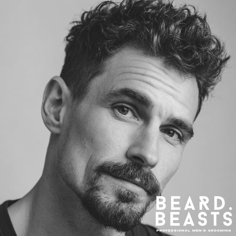 Man with a circle beard—connected mustache and rounded goatee with clean cheeks.