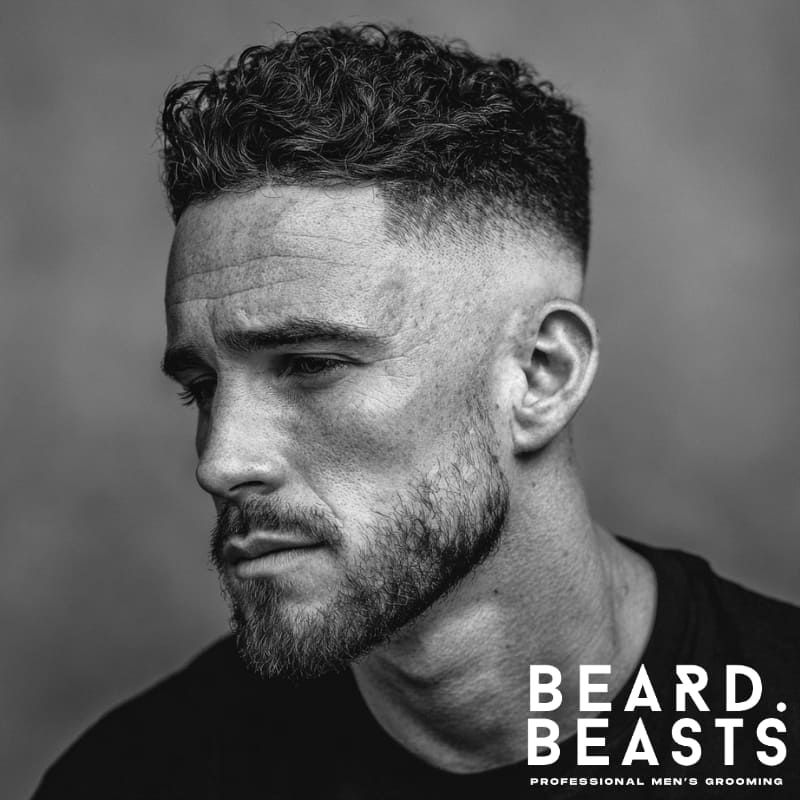 Profile of a man with a fade undercut and short beard, featuring clean transitions and sharp grooming detail