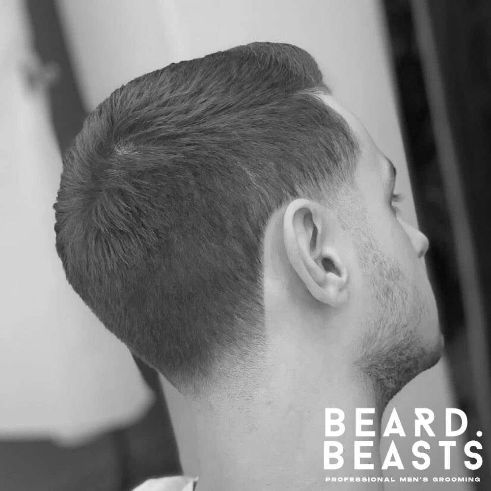 Crew cut with taper fade hairstyle for men featuring a gradual fade at the neckline and sideburns, offering a clean and natural look