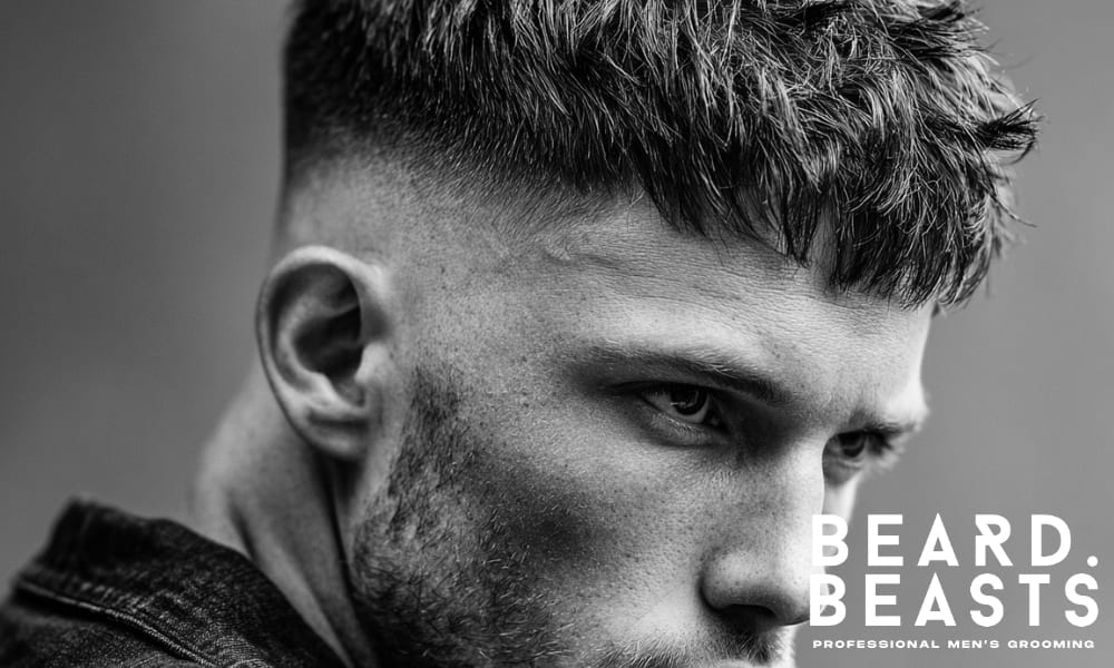 lose-up black and white image of a man's modern haircut with a high fade, perfect for contemporary men's hairstyles.