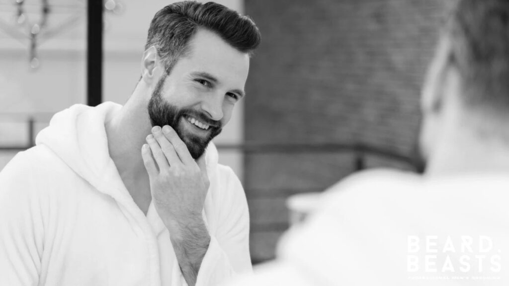 Man inspecting his beard in the mirror, showing the results of exfoliating facial hair for healthier growth and grooming.