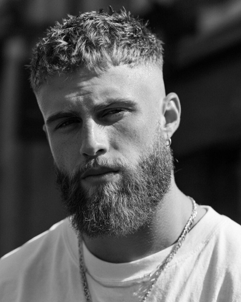 Man with a shaped full beard showing how facial hair can change the shape and balance of the face