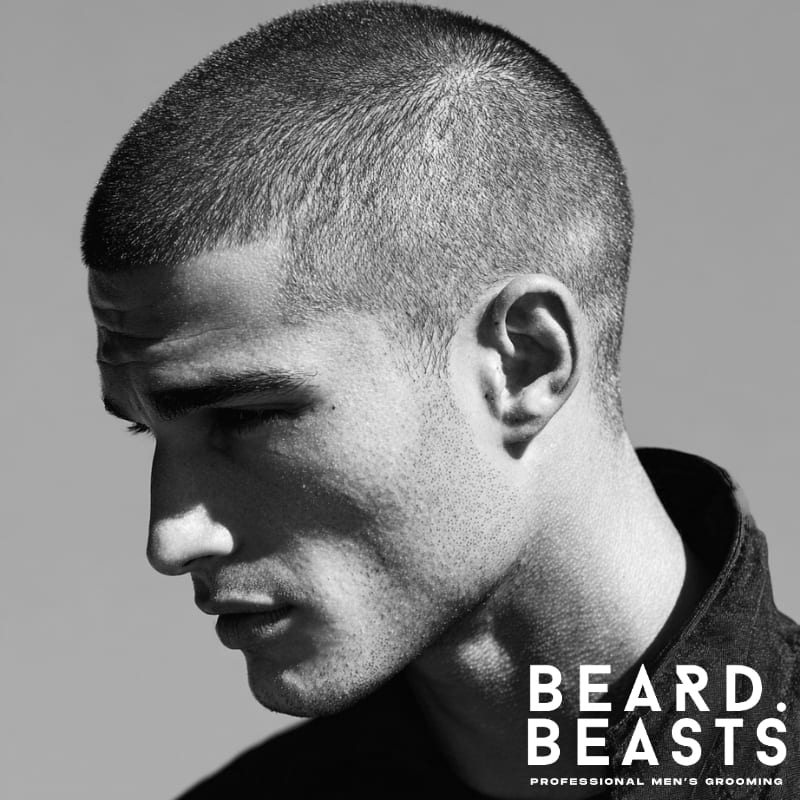 Burr cut military haircut for men, featuring a clean, close-cropped style with very short, even hair all over the head. The haircut offers a sharp, disciplined look with a uniform length, ideal for a low-maintenance, military-inspired style. Perfect for men seeking a bold, no-fuss appearance.