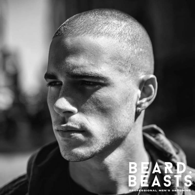Military haircut for men featuring a clean, buzzed style with faded sides and a short, even top. The close-cropped cut offers a sharp, disciplined look, ideal for a professional and low-maintenance hairstyle.