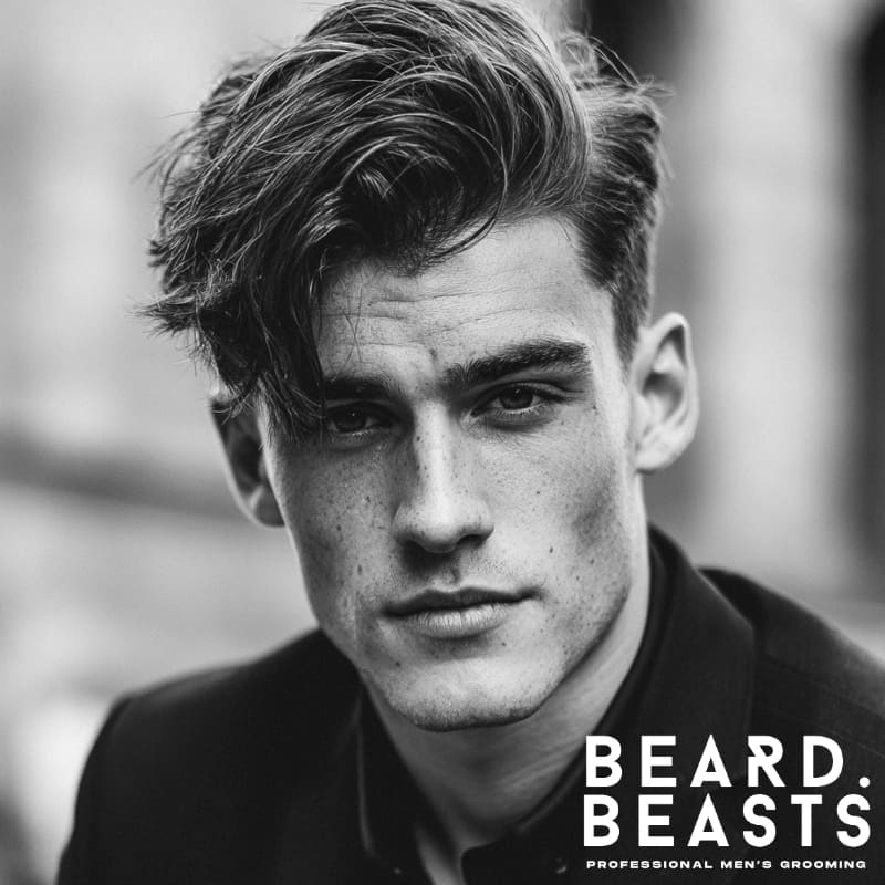 A sleek side part hairstyle for men with a diamond face shape, featuring textured volume that balances sharp features. This side part works to add structure and elongation, making it ideal for men with a diamond-shaped face, offering a sophisticated and modern look.