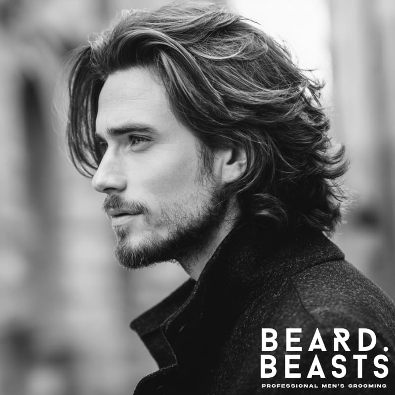 Male model with a layered flow haircut, featuring soft movement, natural volume, and a sleek, effortless style.