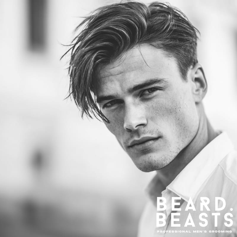 Handsome male model with a men's side-part flow haircut, featuring textured volume and a natural, polished finish.