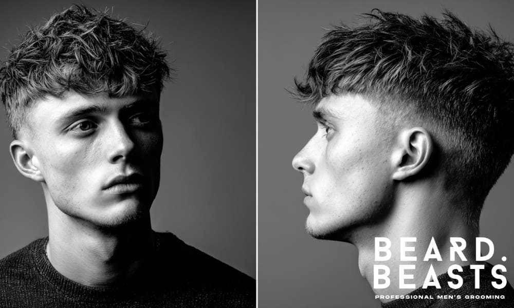 Young man with a short haircut and clean fade, featuring choppy layers on top and a defined fade for a modern, polished style.