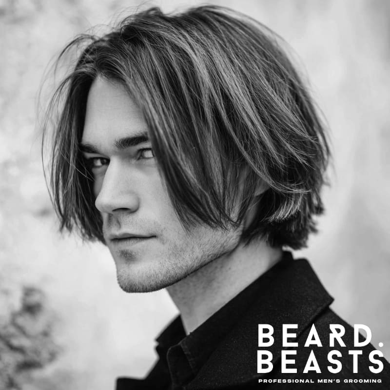 A sleek, chin-length bob with a blunt, straight cut and clean lines. This timeless, structured hairstyle features minimal texture, ideal for men seeking a classic, sophisticated look with a polished finish.